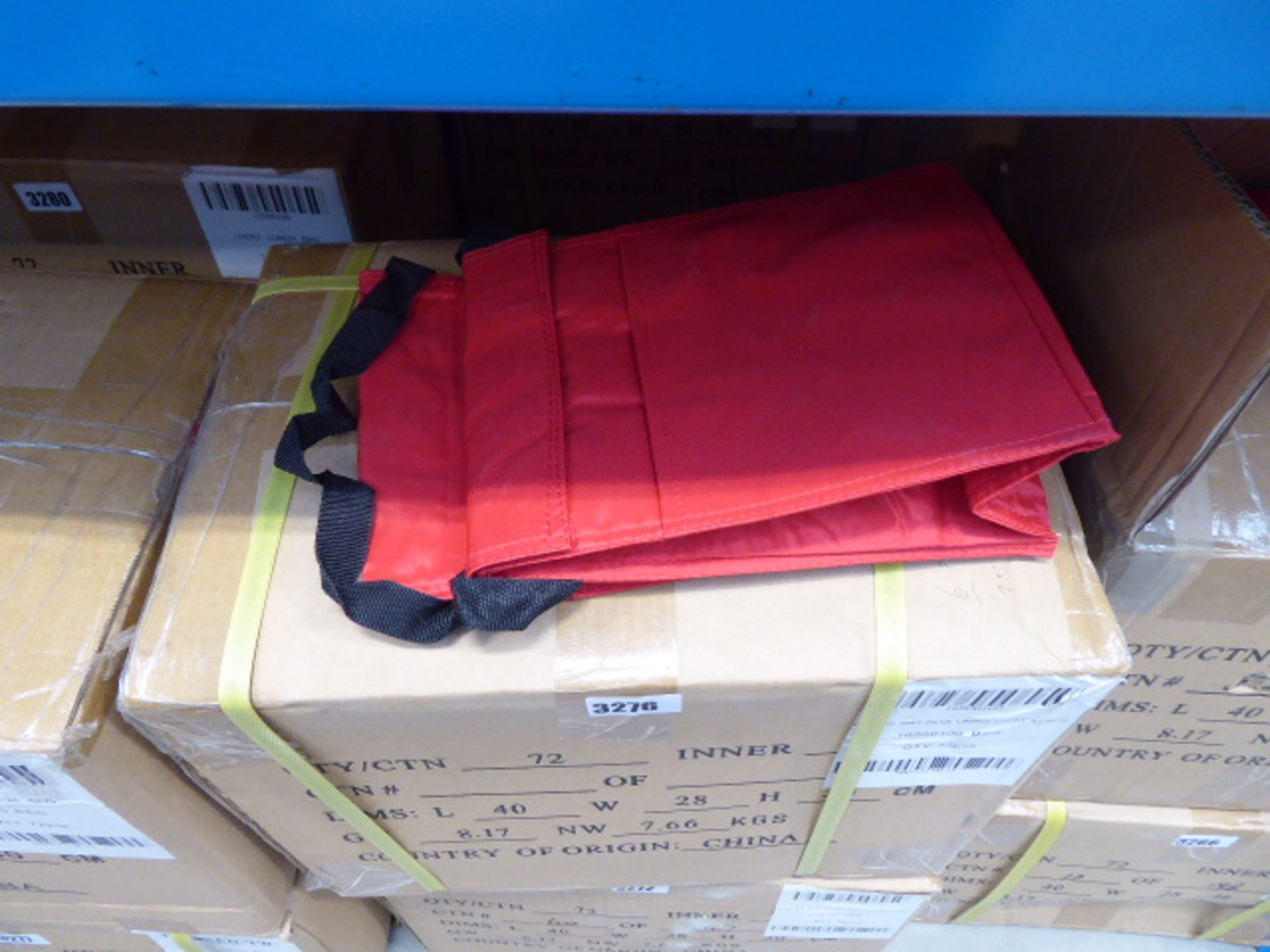 Box containing approximately 72 Lucky Lunch bags in red