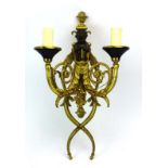 A 19th century and later bronze and ormolu wall light of figural form,