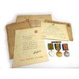 A medal group comprising 1914-1948 War Medal, Victory Medal with oak leaf and WWII Defence Medal,