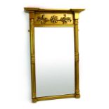 A 19th century and later wall mirror with a foliate frieze and classical pilasters,