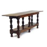 An 18th century-type oak refectory table,