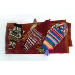 A group of South American textiles including a beadwork hat and other items,