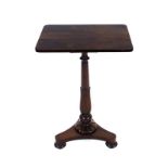 An early 19th century rosewood occasional table, the rectangular surface over a tapering support,