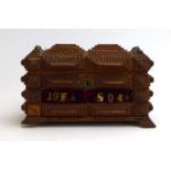 A Tramp Art box with brass studs, dated 1904, w.