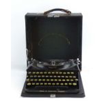 A cased Imperial 'The Good Companion' portable typewriter manufactured by The Imperial Typewriter