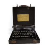 A cased 1929 Remington 'Noiseless Portable' typewriter, 'World Service' label to case,