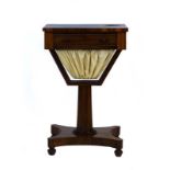 A 19th century rosewood sewing table, the single drawer over a suspended basket on a turned column,