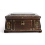 A 19th century rosewood and mother-of-pearl inlaid box of sarcophagus form on bun feet, w.