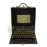 A cased 1929 Remington 'Portable' typewriter, 'World Service' label to the case,