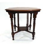 An Edwardian mahogany occasional table of octagonal form on turned legs joined by a lower tier, w.