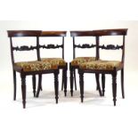 A set of four William IV rosewood bar-back dining chairs with drop-in seats on turned front legs