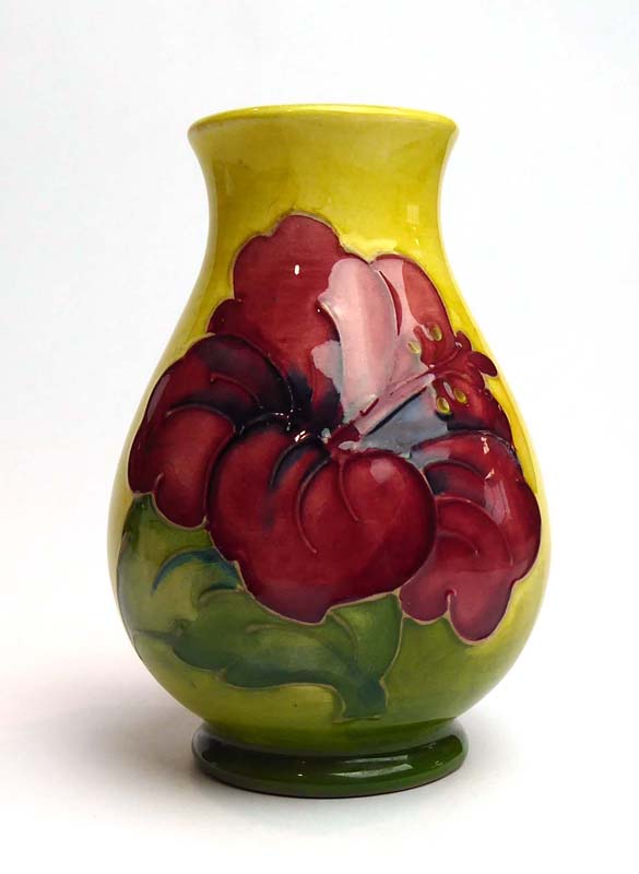 A Moorcroft miniature vase of ovoid form decorated with anemone on a shaded yellow/green ground, h.