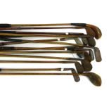 A group of fourteen various vintage golf clubs