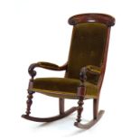 A Victorian mahogany and button upholstered rocking chair