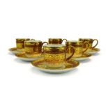 A set of six Limoges coffee cans and saucers,