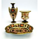 A Royal Crown Derby miniature two handled vase of elongated hexagonal form,