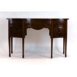 A Sheraton-style mahogany and strung serpentine fronted sideboard, on tapering legs with block feet,