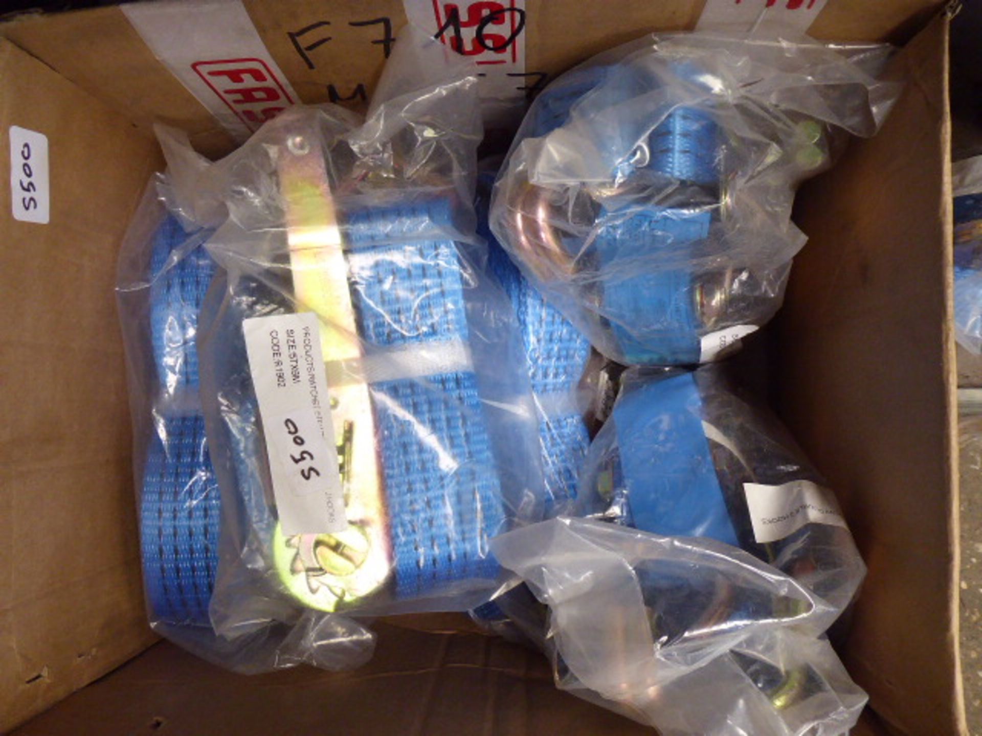 Large box containing blue ratchet tie down straps