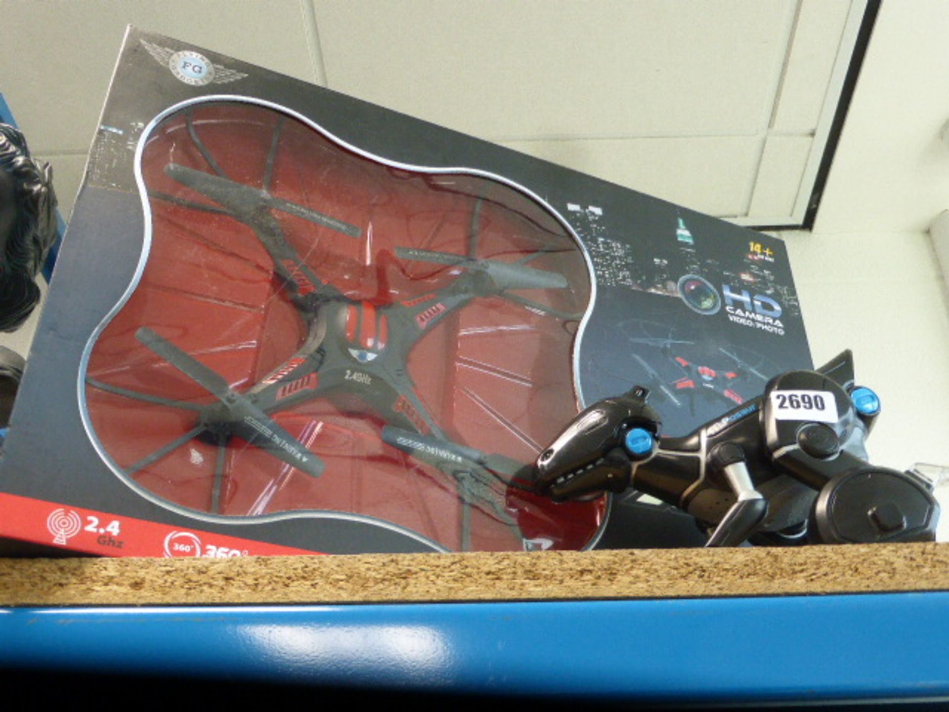 HD drone in box together with dinosaur r/c toy