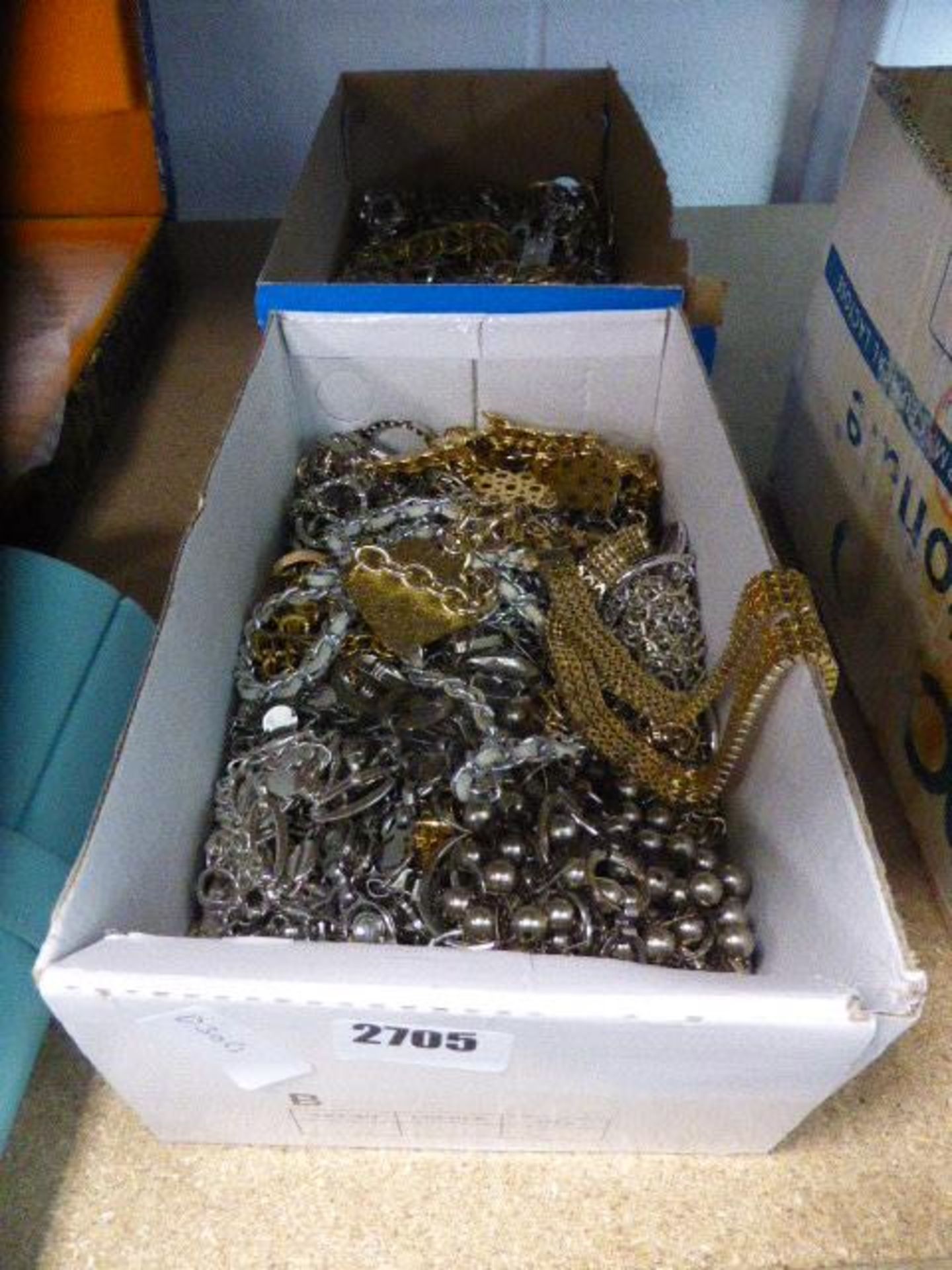 Two cardboard boxes of loose costume jewellery items