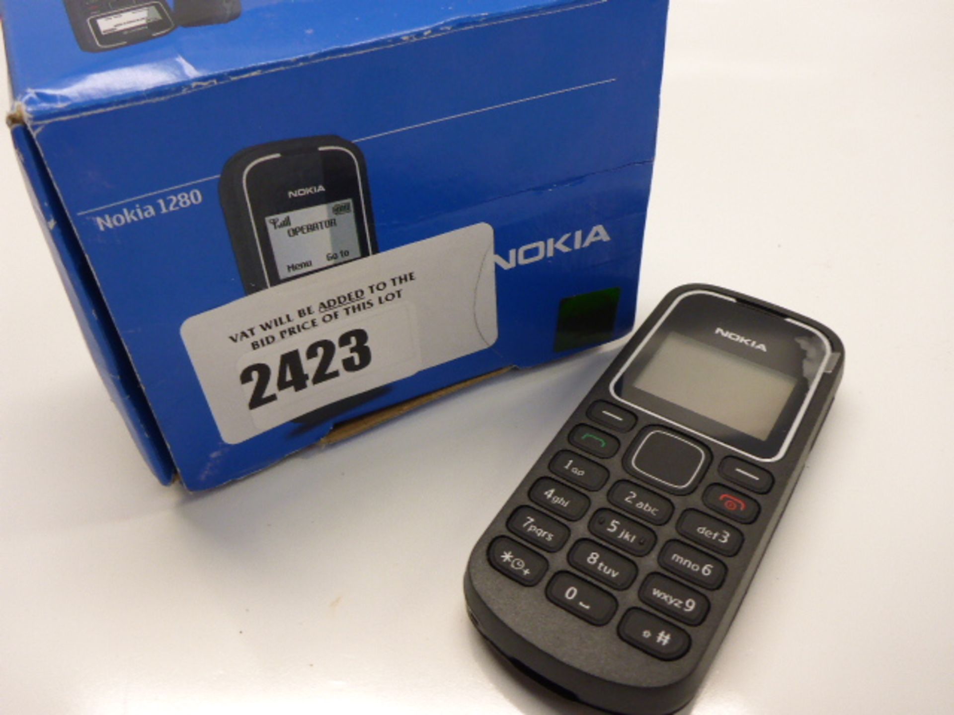 Nokia 1280 mobile phone with box.