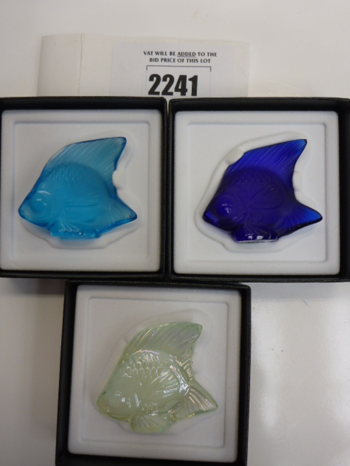 Three Lalique fish in boxes.