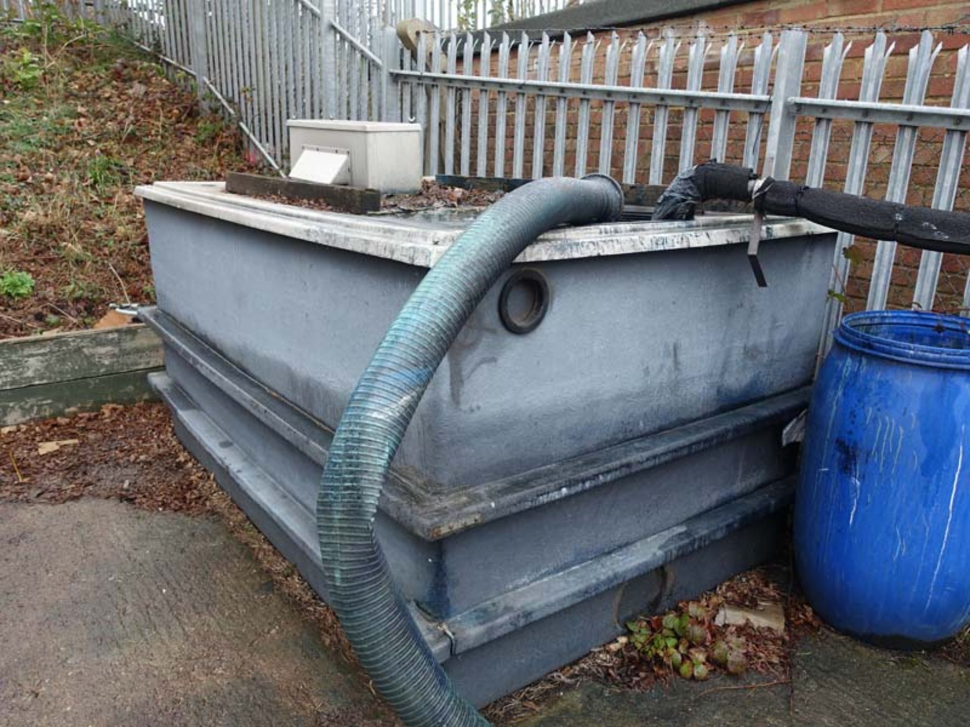 Fibreglass approx. 1000 litre waste ink reservoir together with approx 50m of plastic delivery