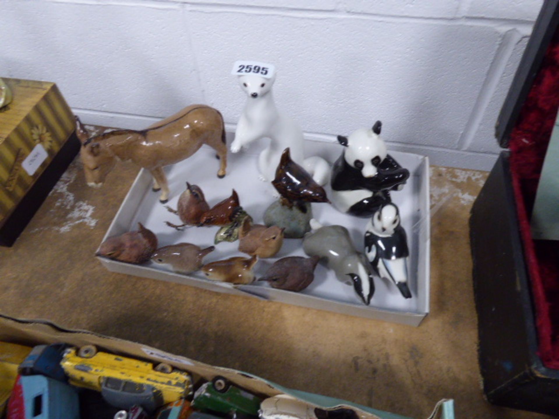 13 pieces of collectable ceramic animal figures mostly birds to include donkey, panda etc