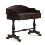 A 19th century mahogany Irish washstand, the galleried surface over two frieze drawers,