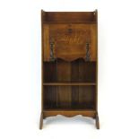 A Commercial Arts & Crafts oak and brass mounted student's bureau, w.