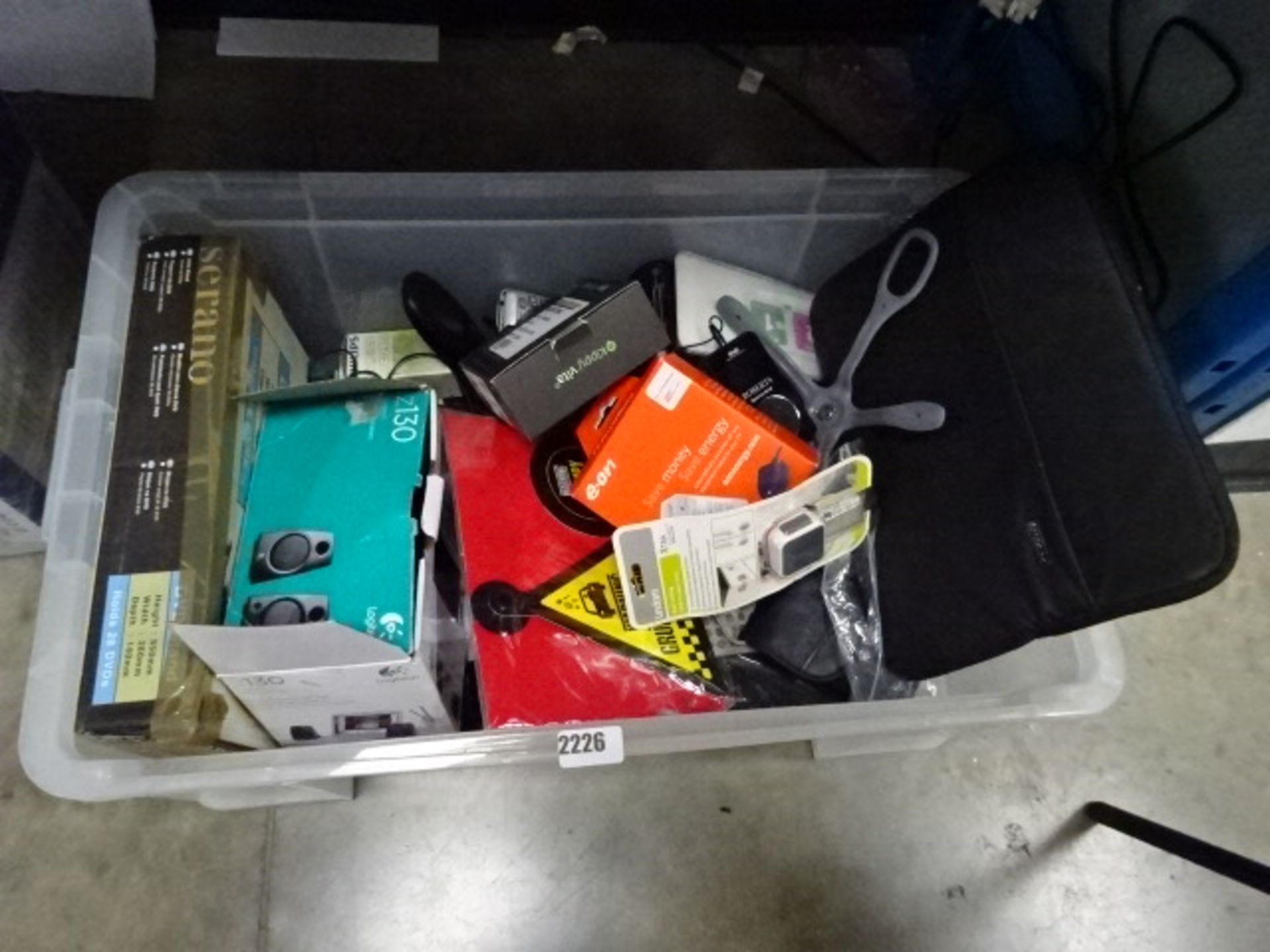 Box of electronic items including Logitech Z130 speakers, Vodofone pet tracker and other mixed IT