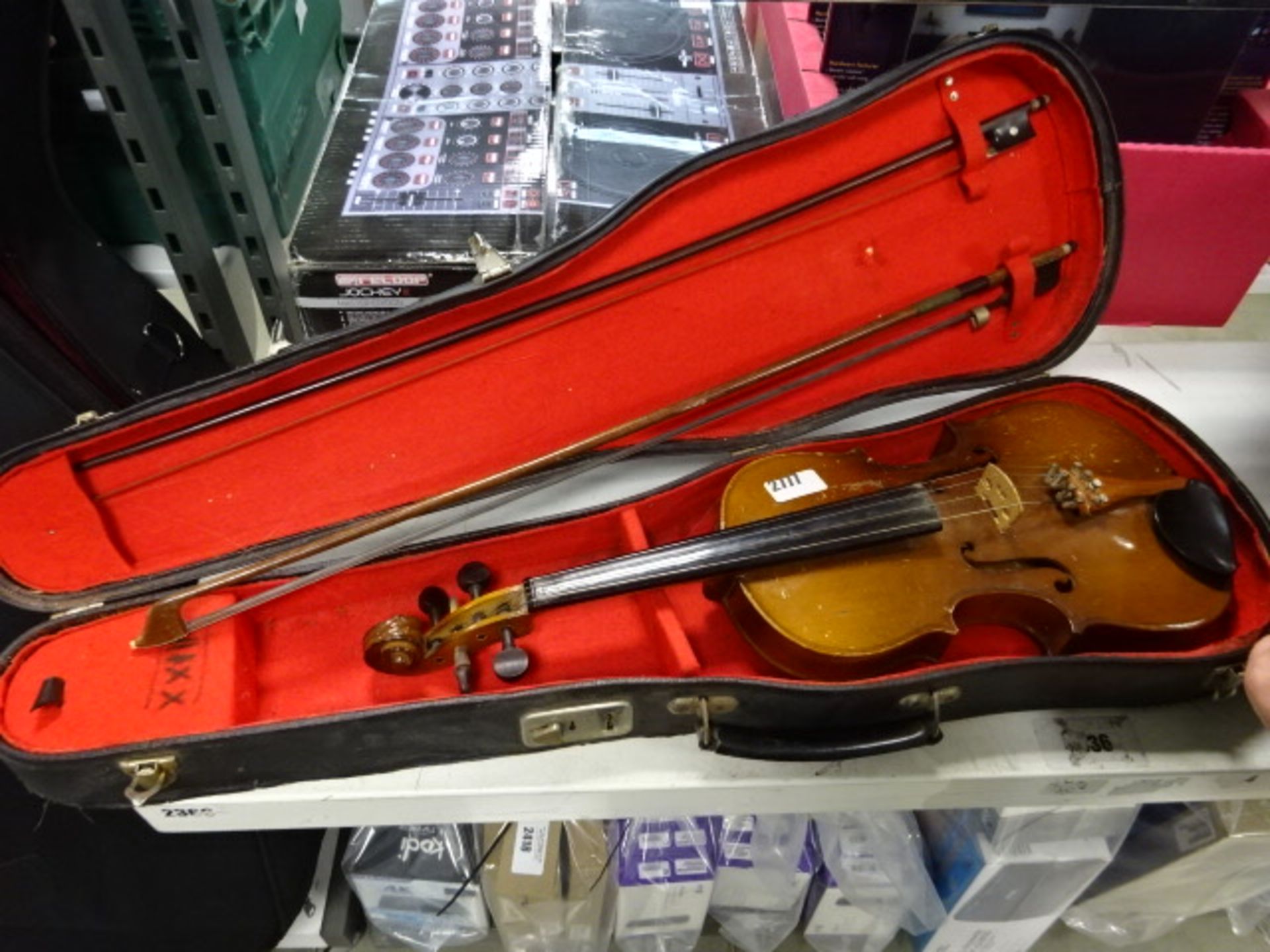 A violin with hard case and bow