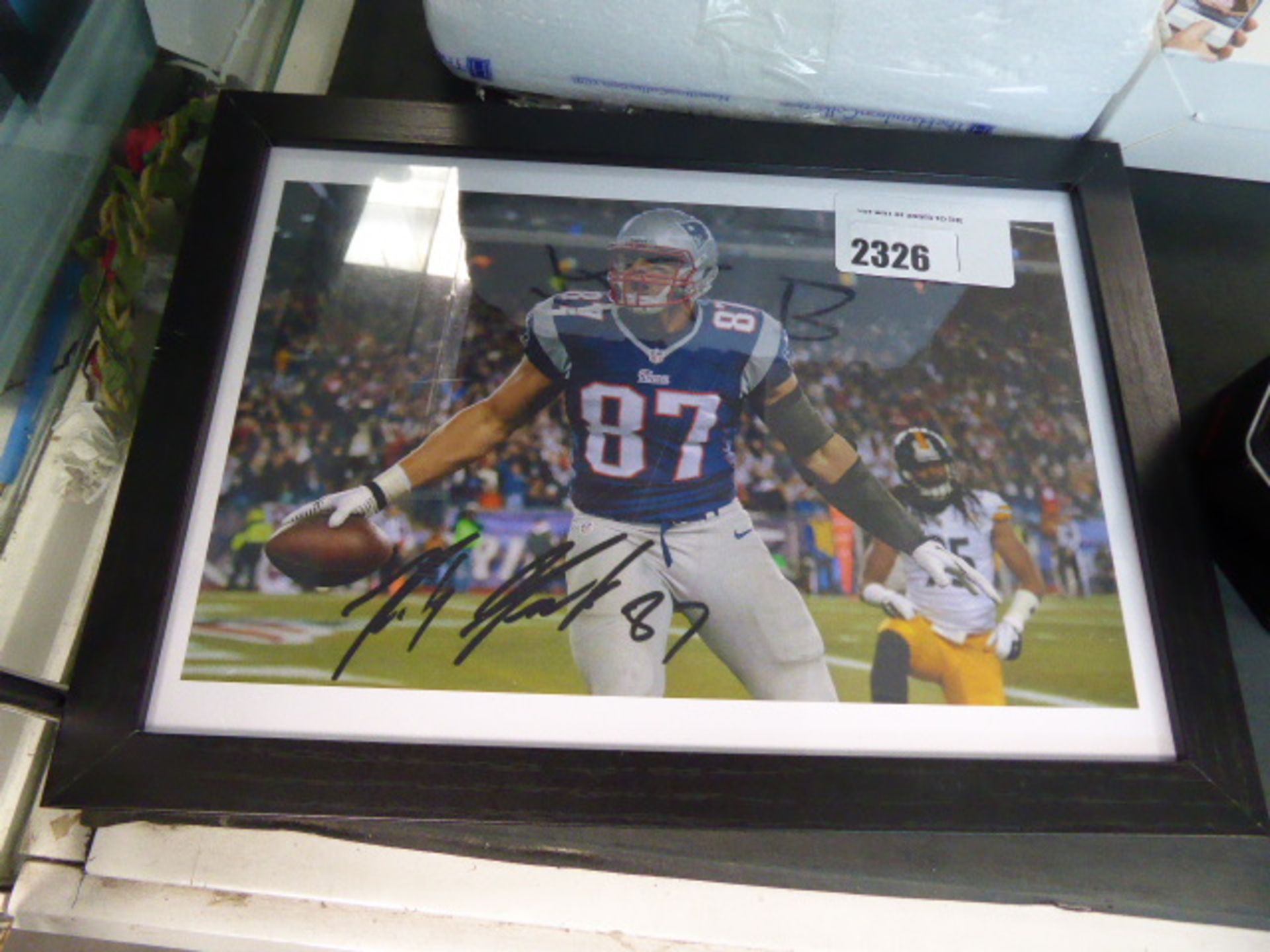 2079 NFL football signed photograph (unverified)