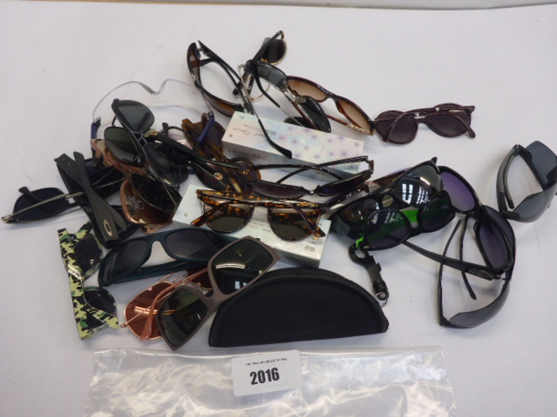 Bag containing quantity of various generic and branded sunglasses