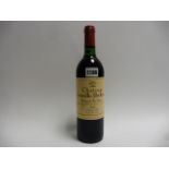 A bottle of Chateau Leoville Poyferre 1983 Saint Julien (ullage top shoulder/into neck)