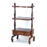 A Victorian rosewood three-tier what-not-stand with shaped shelves,