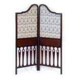 An Edwardian and later upholstered mahogany framed two-fold screen,