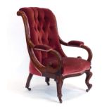 A Victorian mahogany and button upholstered fireside armchair with scrolled arms,