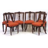 A set of six late 19th century mahogany and upholstered dining chairs on turned front legs,