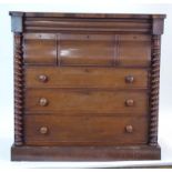 A 19th century mahogany 'Scotch' chest with a narrow bombe drawer over three deep drawers and three