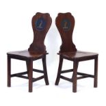 A pair of Victorian mahogany hall chairs,