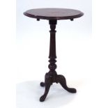 A 19th century marquetry wine table, the tilt-top on a turned column and tripod base, d.