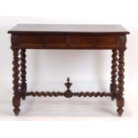 A French walnut and crossbanded writing table with two frieze drawers on barley twist supports,