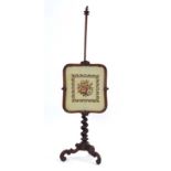 A Victorian mahogany polescreen, the tapestry screen on a straight shaft,