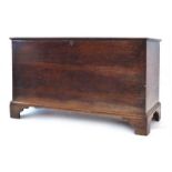 An 18th century and later oak and crossbanded coffer on bracket feet, w.