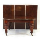 A 19th century mahogany extending dining table, with three fitted leaves,