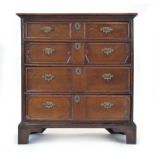 A Charles II and later oak chest of four long graduated drawers with geometric moulding,