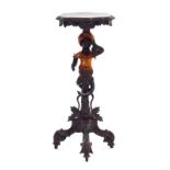 A figural ebonised torchere in the 19th century Venetian manner,