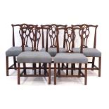 A set of five Hepplewhite-type mahogany and upholstered dining chairs