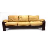 A Norwegian three-seater sofa with a bentwood frame and pale brown leather upholstery